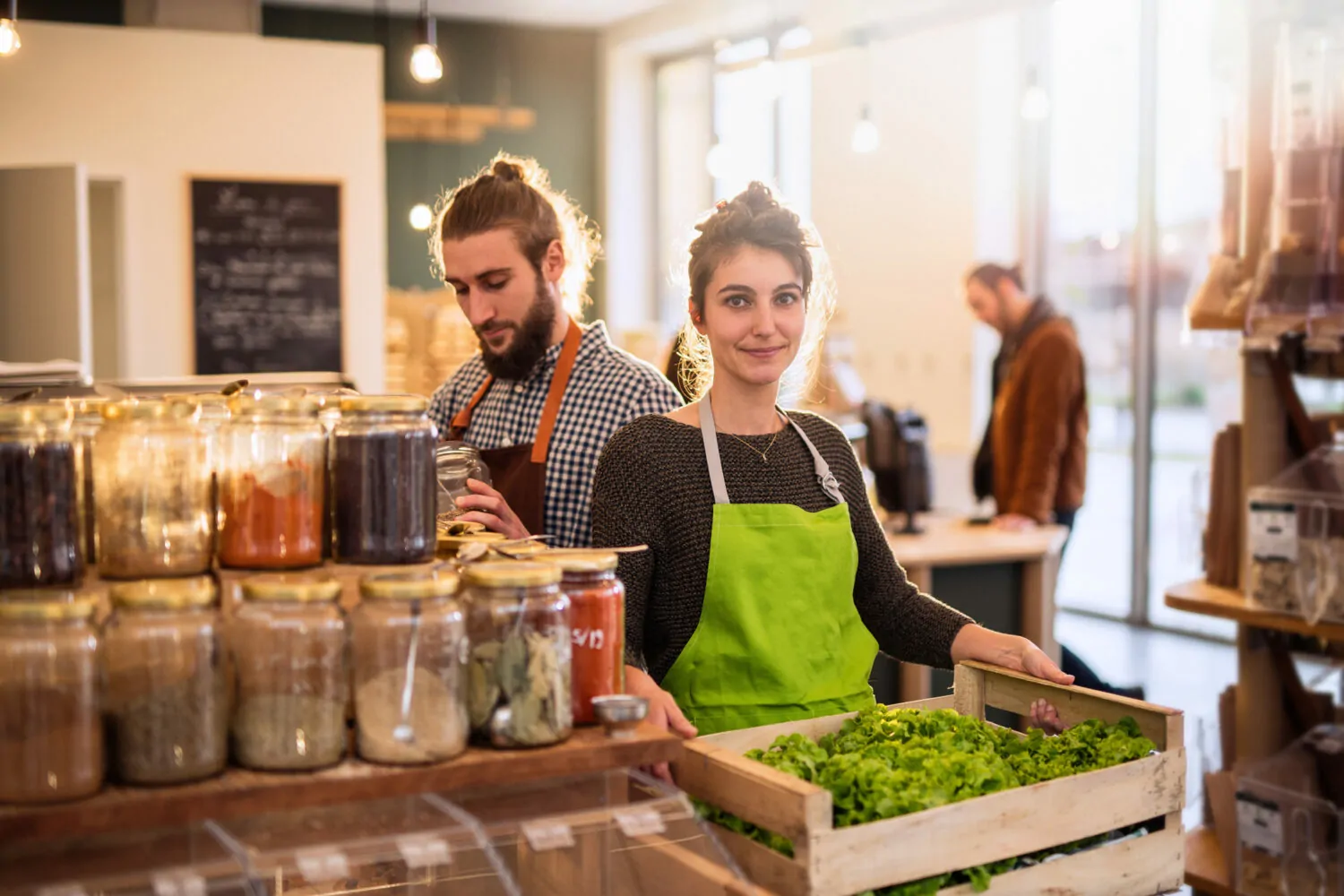 Staff stood in a wholefoods store smiling after securing their accountant in manchester