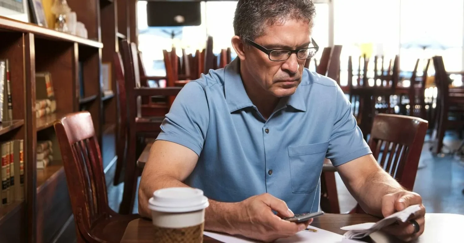 A man reading about the mistakes business owners make when applying for finance