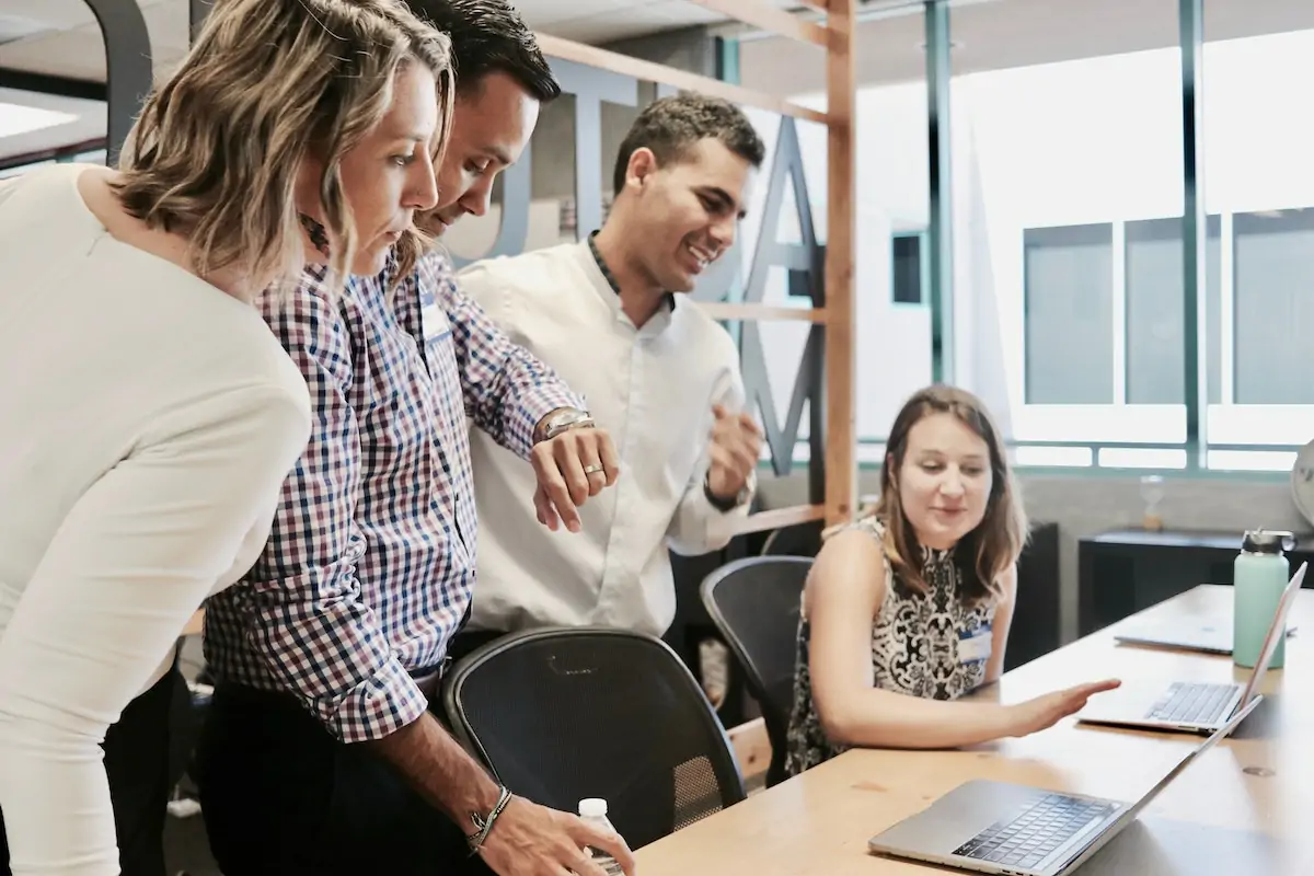 A group of people reviewing sustainable businesses